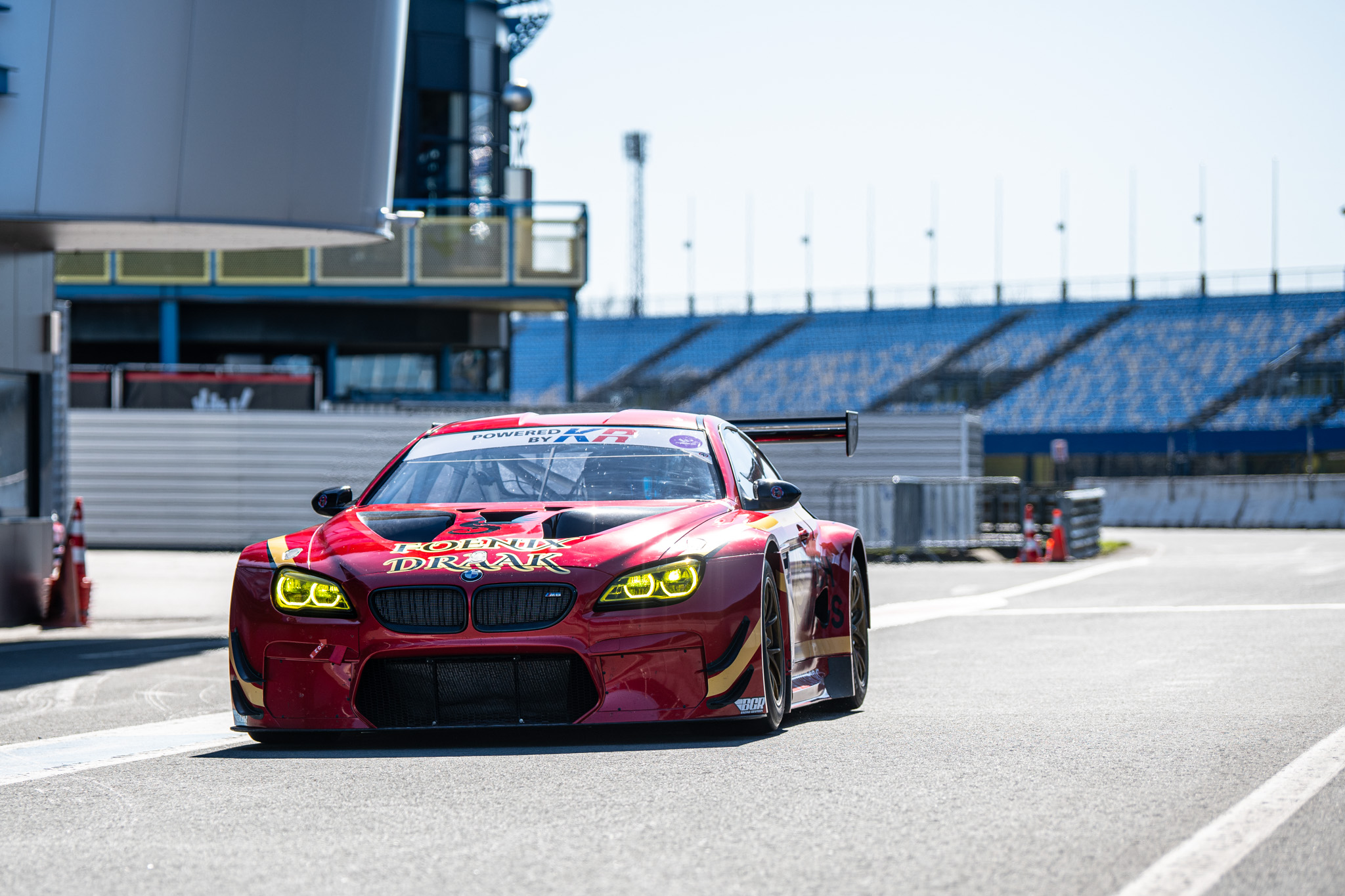 Marlon Birdsall standing beside his BMW M6 on the pit lane